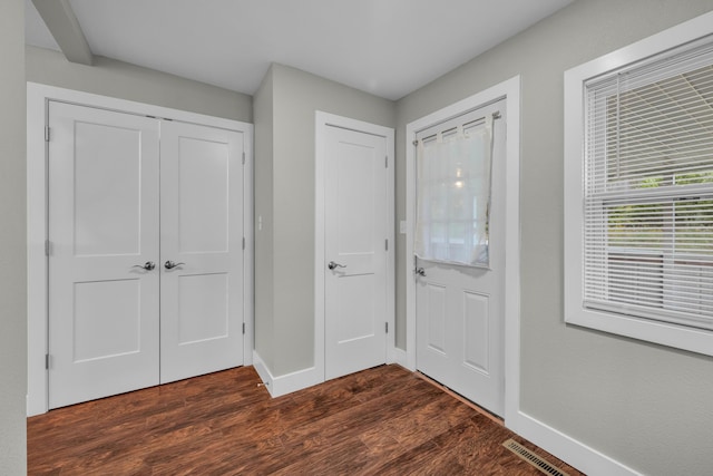 entrance foyer with dark hardwood / wood-style flooring