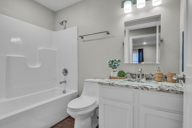 full bathroom with shower / washtub combination, vanity, and toilet