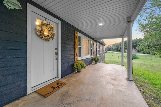 exterior entry at dusk with a yard