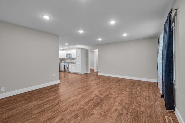 unfurnished living room featuring hardwood / wood-style floors