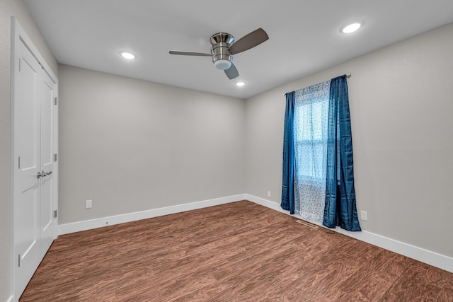 unfurnished room featuring ceiling fan and hardwood / wood-style floors