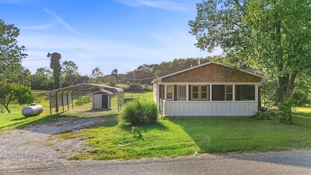 view of side of property featuring a yard and a carport