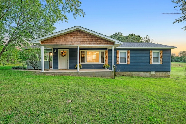 view of front of home featuring a yard and covered porch