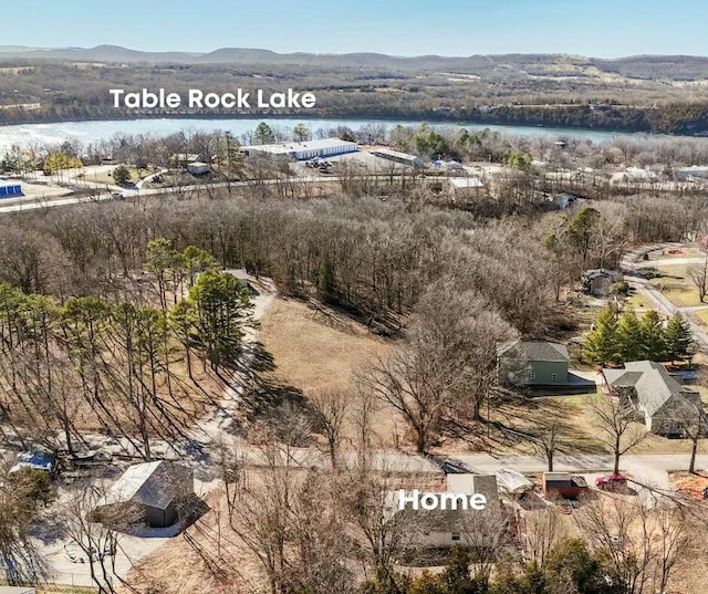 bird's eye view with a water and mountain view