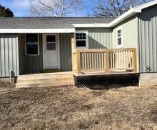 rear view of property with a deck