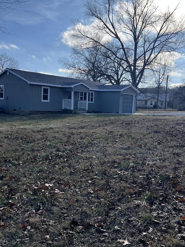 back of house with a garage