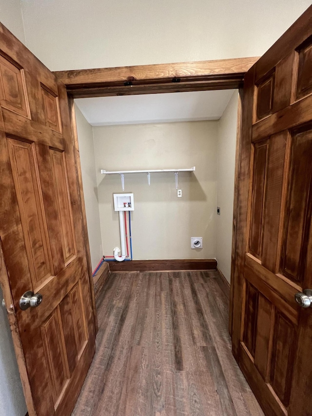 laundry area featuring electric dryer hookup, washer hookup, and dark hardwood / wood-style floors