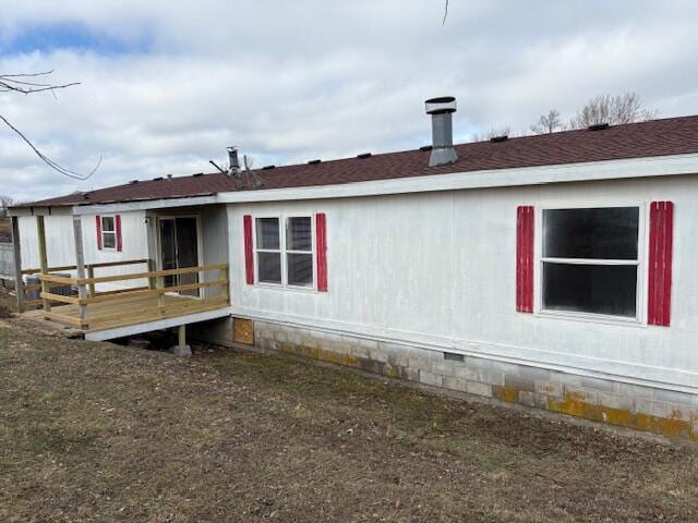 view of property exterior with a deck