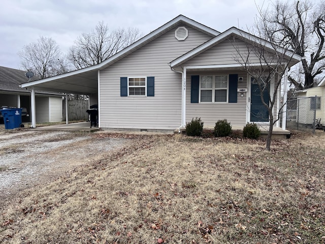 view of front of home featuring a carport