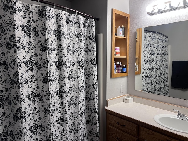 bathroom featuring vanity and walk in shower