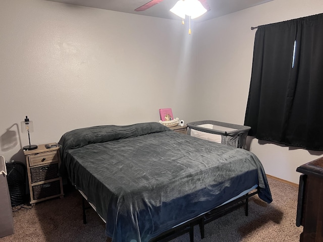 bedroom featuring dark colored carpet and ceiling fan