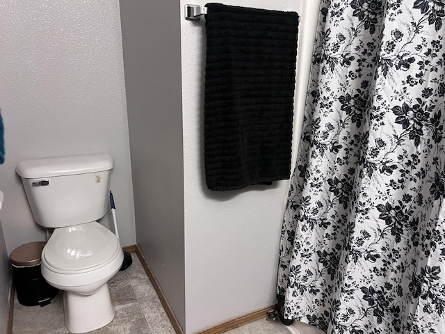 bathroom featuring toilet