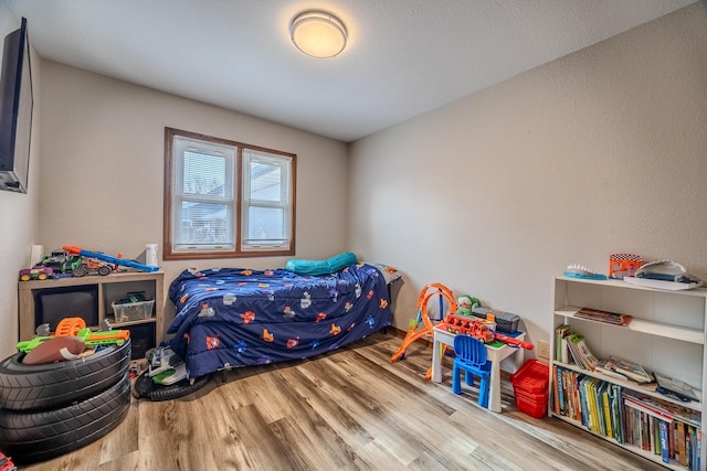 bedroom featuring hardwood / wood-style flooring