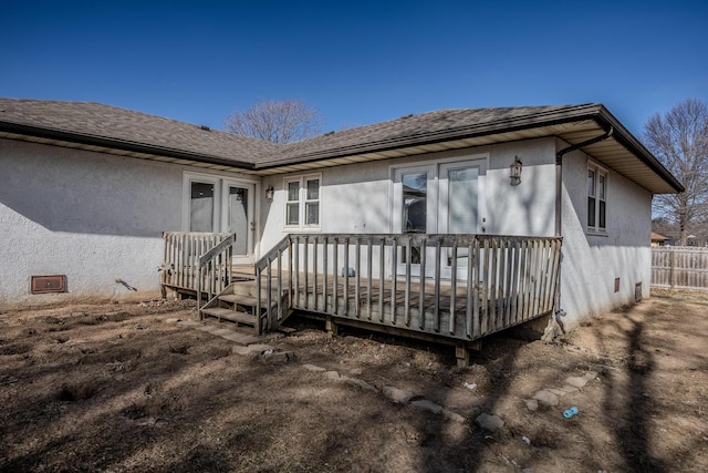 back of house with a wooden deck