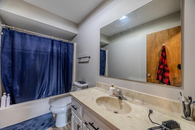 full bathroom featuring vanity, shower / bath combo, and toilet