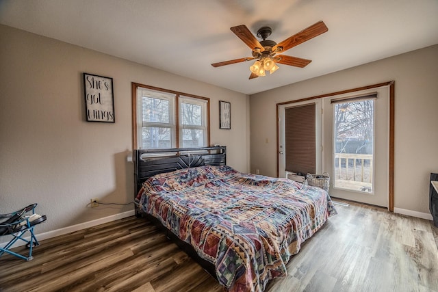 bedroom with hardwood / wood-style flooring, access to exterior, and ceiling fan