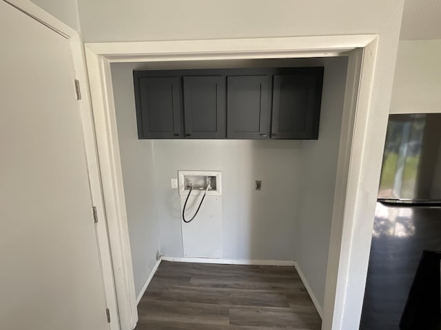 laundry area with dark hardwood / wood-style flooring, electric dryer hookup, hookup for a washing machine, and cabinets