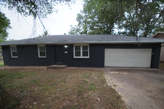 single story home featuring a garage