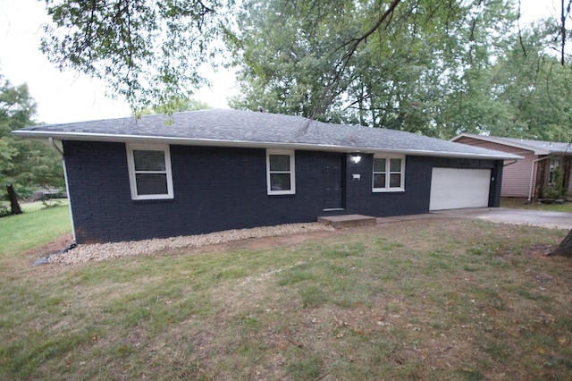 ranch-style home featuring a garage and a front yard