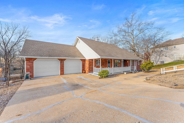 view of front of property featuring a garage and covered porch