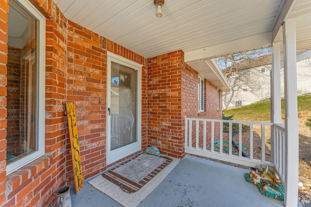 doorway to property featuring a porch