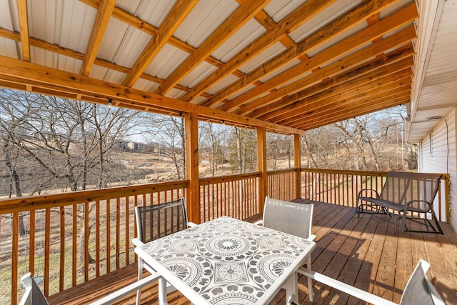 wooden deck featuring outdoor dining area