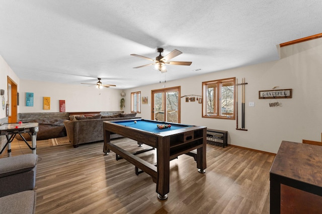 playroom with ceiling fan, hardwood / wood-style floors, a textured ceiling, and pool table