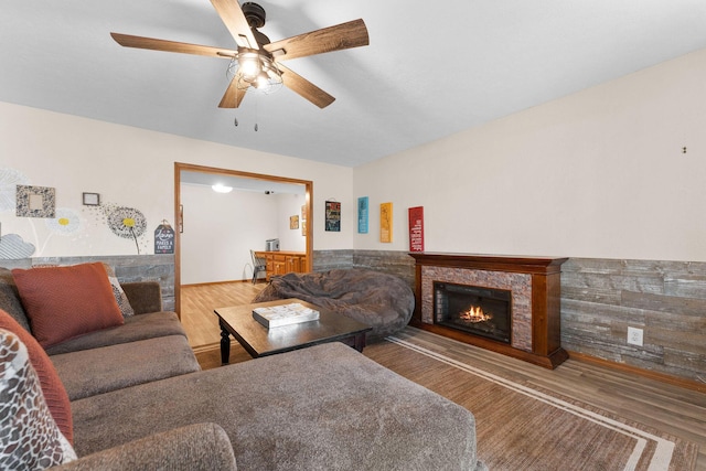 living room with hardwood / wood-style floors and ceiling fan