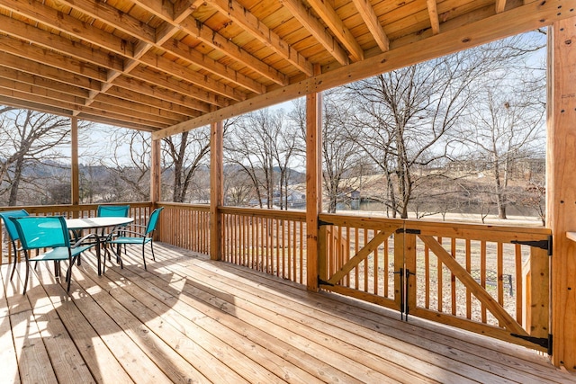 wooden deck featuring outdoor dining area