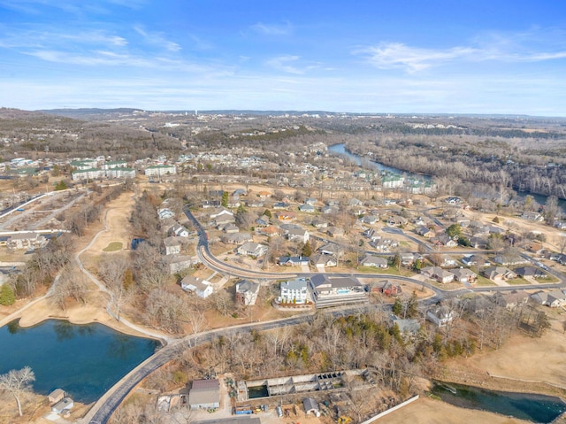 drone / aerial view with a water view and a residential view