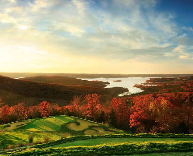 view of property's community featuring a water view and golf course view