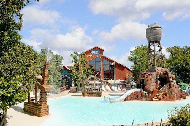 view of pool featuring a water slide