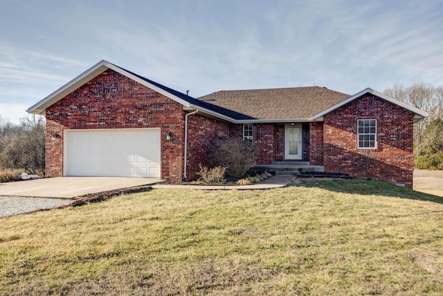 view of front of home with a garage and a front lawn