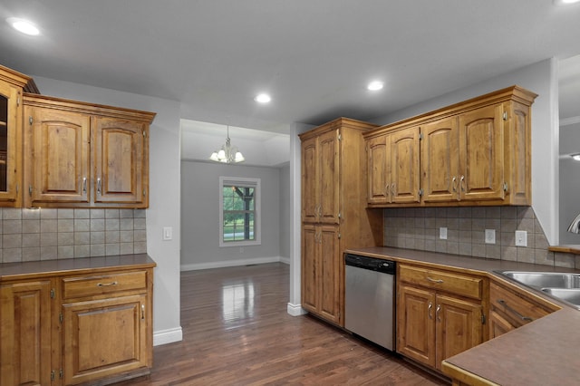 kitchen with sink, decorative light fixtures, a chandelier, stainless steel dishwasher, and dark hardwood / wood-style floors