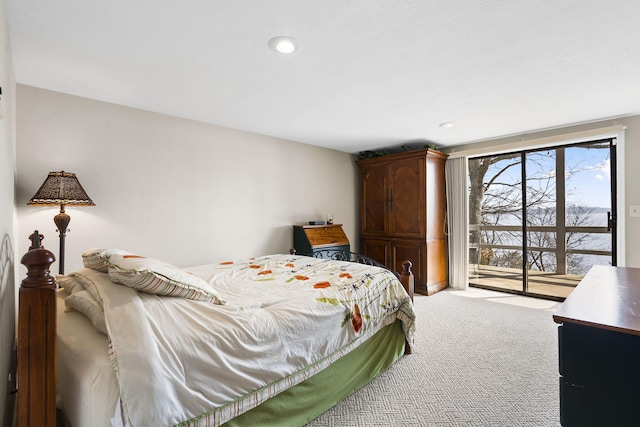 bedroom featuring carpet flooring and access to outside