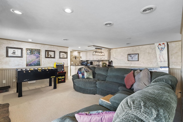 carpeted living room with crown molding