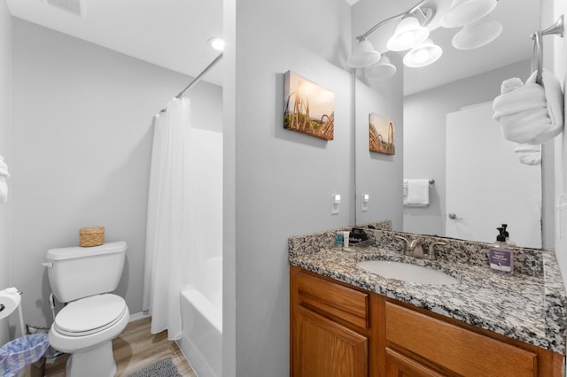 full bathroom with vanity, toilet, wood-type flooring, and shower / bath combo with shower curtain