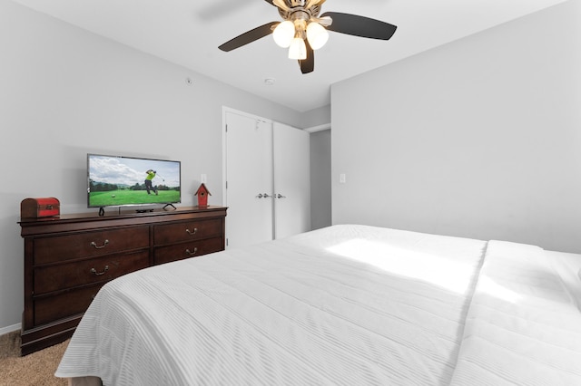 bedroom featuring ceiling fan and light colored carpet