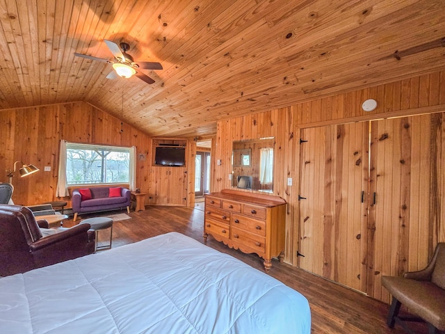 bedroom with hardwood / wood-style flooring, wood walls, lofted ceiling, and wooden ceiling