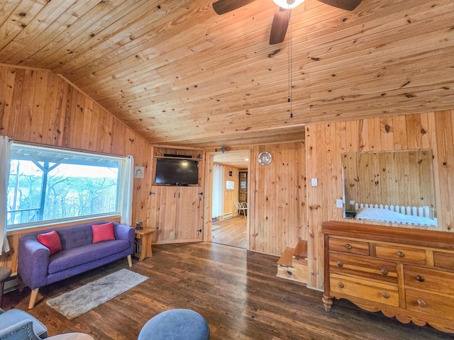 living room featuring wood ceiling, wood-type flooring, vaulted ceiling, wooden walls, and ceiling fan