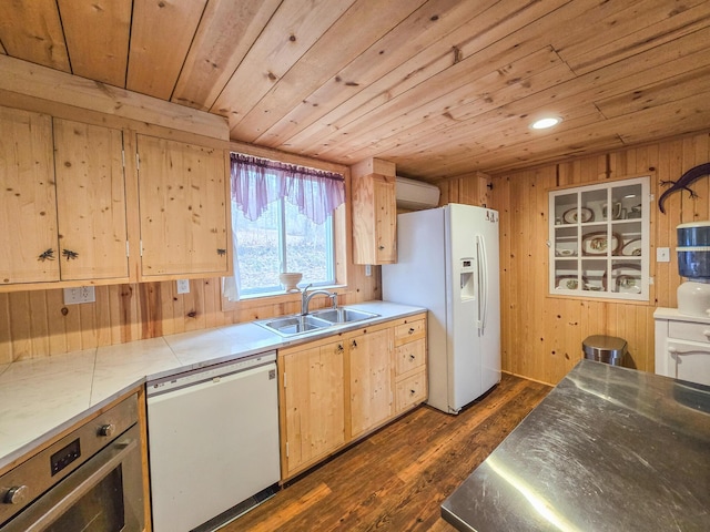 kitchen featuring sink, wooden walls, wooden ceiling, and white appliances