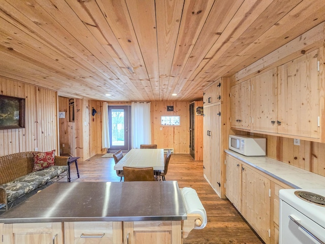 kitchen featuring wood ceiling, white appliances, dark hardwood / wood-style floors, a center island, and light brown cabinetry