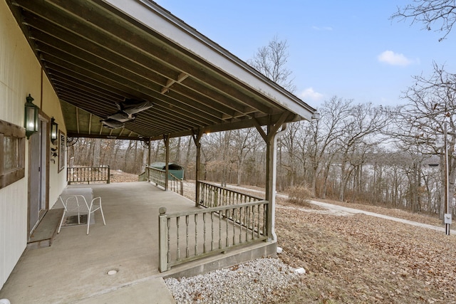 view of patio / terrace with ceiling fan and a porch