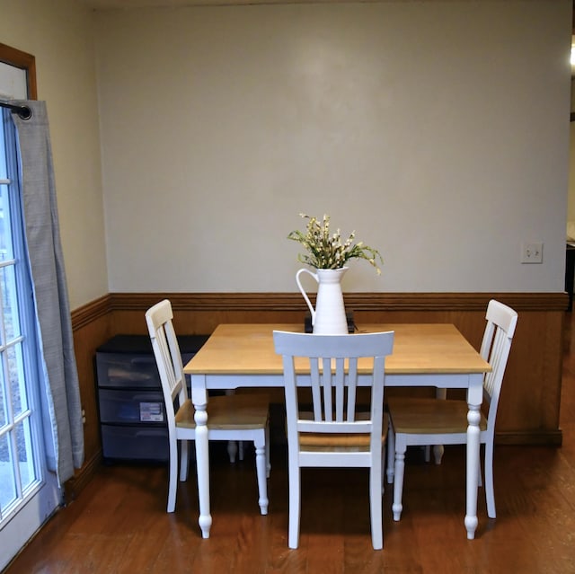 unfurnished dining area featuring dark hardwood / wood-style flooring