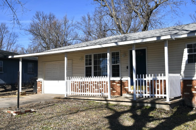 view of front of property with a garage and covered porch