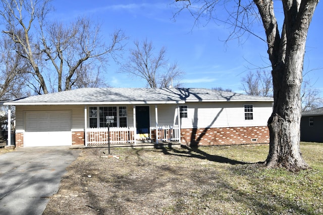 ranch-style home with a garage and covered porch