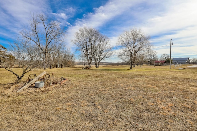 view of yard with a rural view