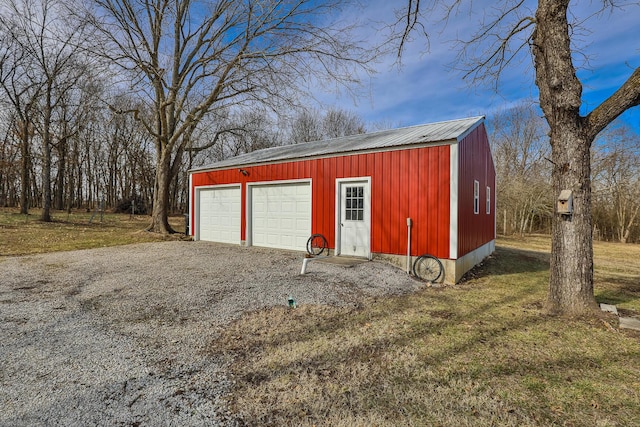 garage featuring a lawn