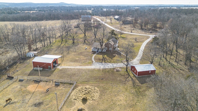 birds eye view of property with a rural view