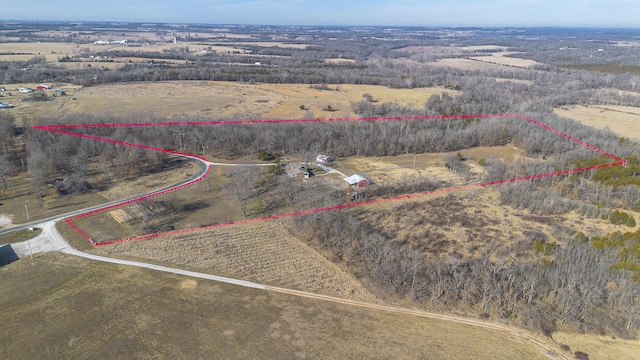 birds eye view of property with a rural view